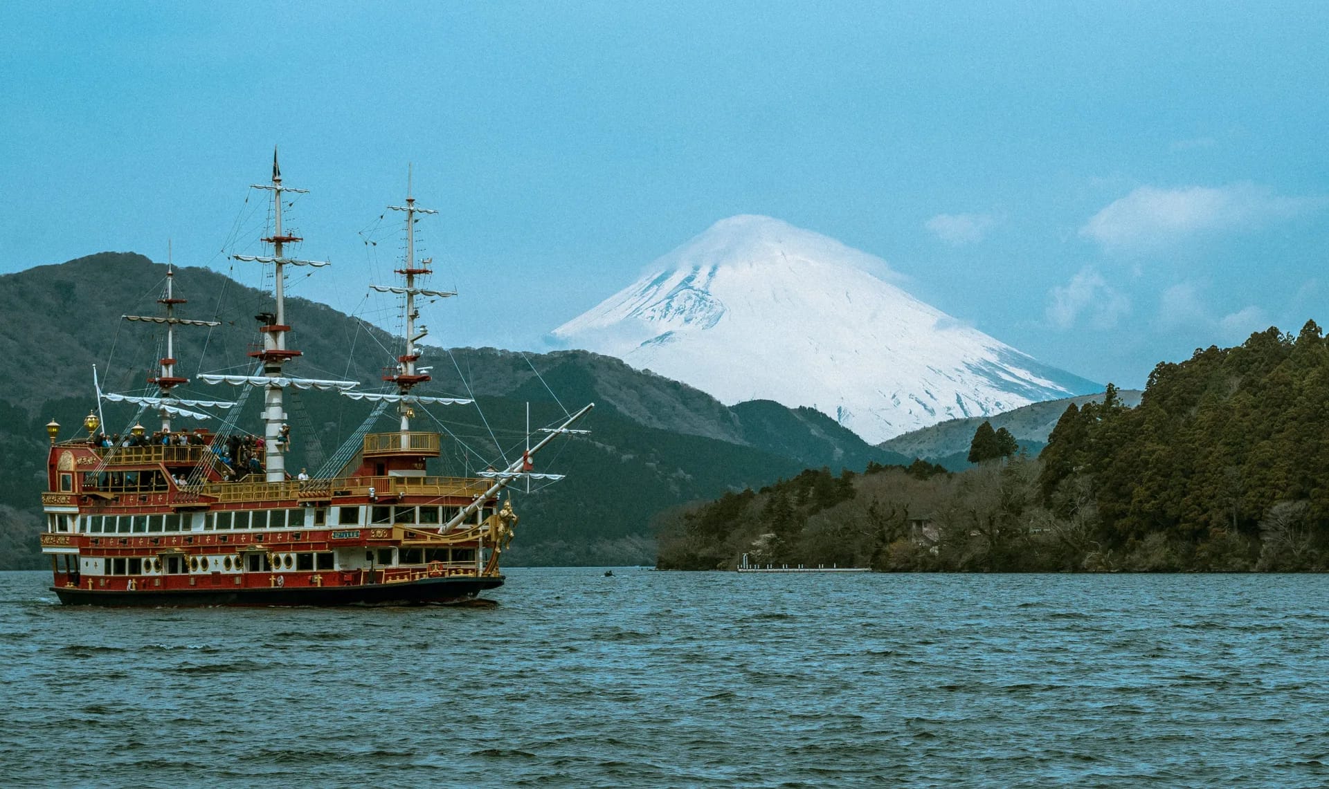 Red pirate ship on Lake Ashi with snow-capped Mount Fuji behind